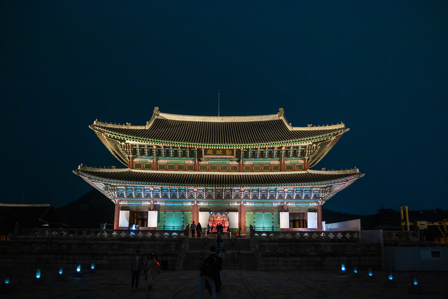 a wide shot of the main throne room at gyeongbokgung at night