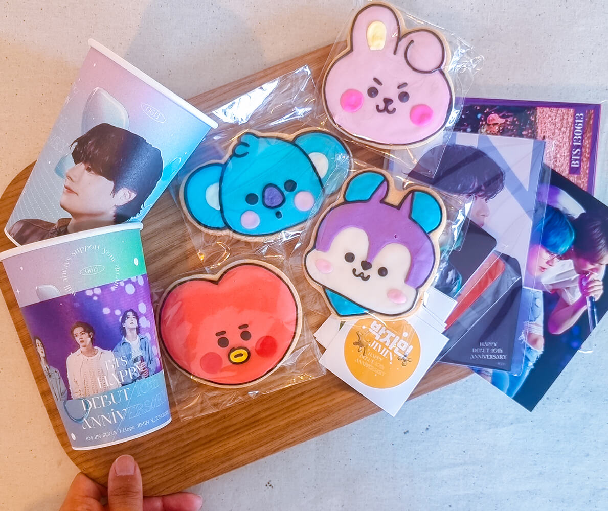 cookies, cup sleeves and photo cards of BTS